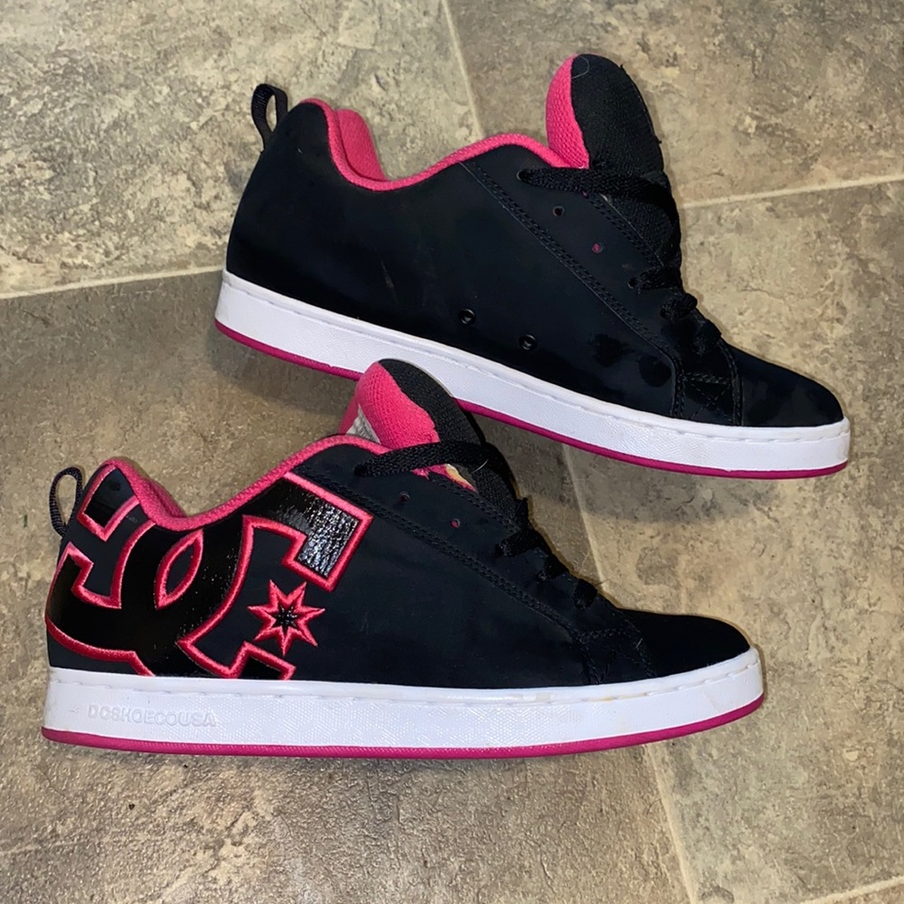 Woman’s hot pink and black DC shoes